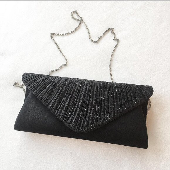 Como Vintage Handbags - Classic black clutch Perfect condition BRAND NEW WITH TAGS The length of the str